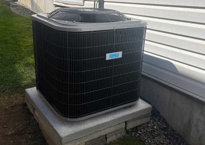 Amplified HVAC KeepRite heat pump beige house