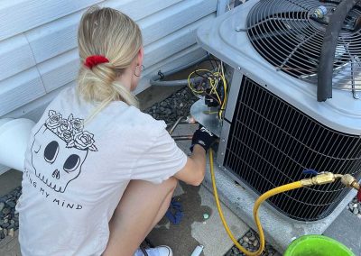 Amplified HVAC our tech installing heat pump